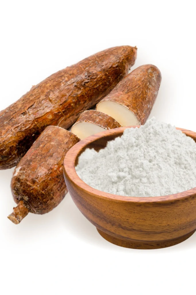 Arrowroot Powder in a bowl along with raw Arrowroot