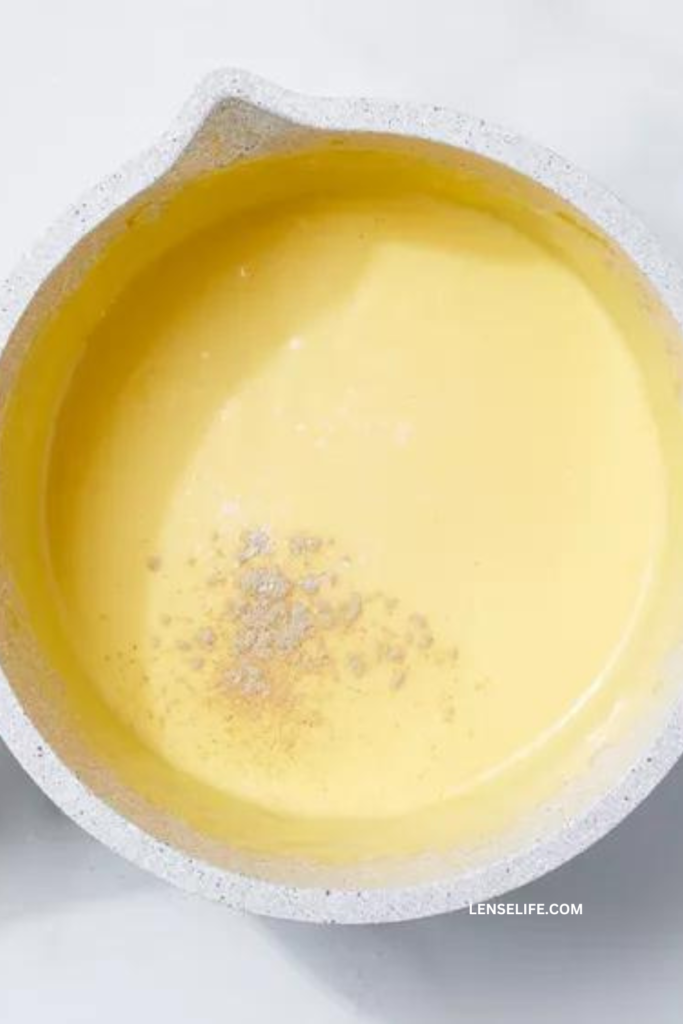 combining melted butter and egg yolks