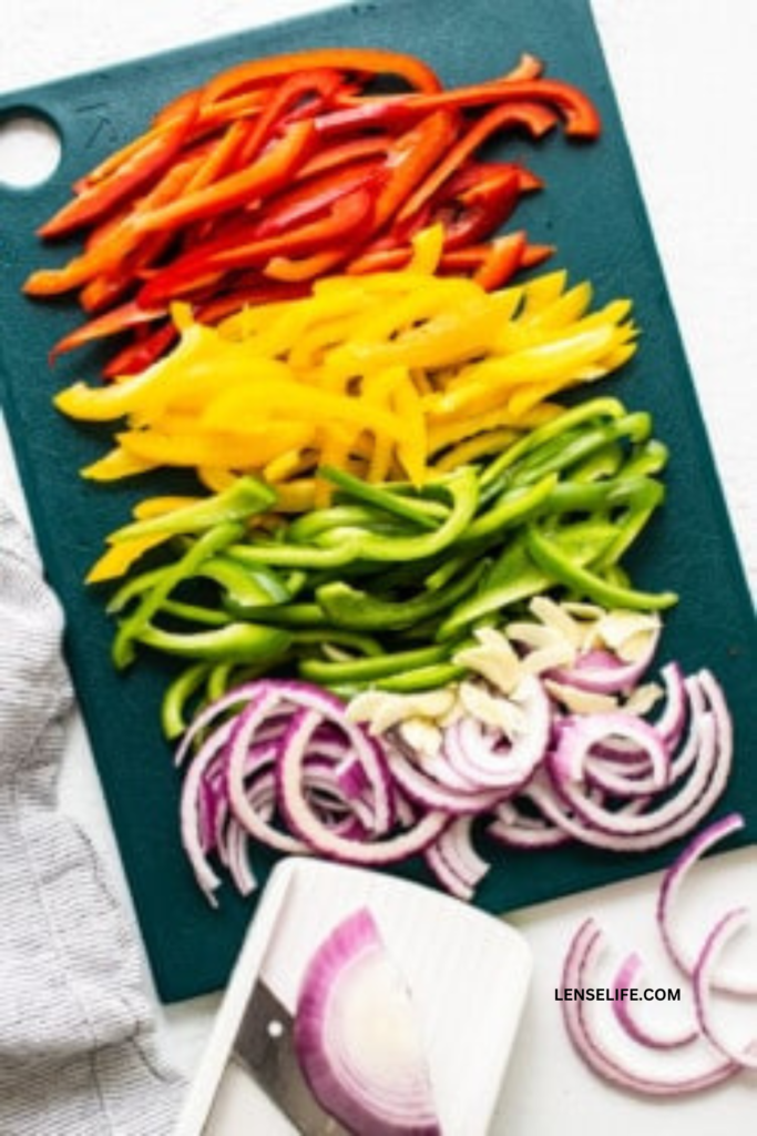 Evenly sliced bell peppers and onions 