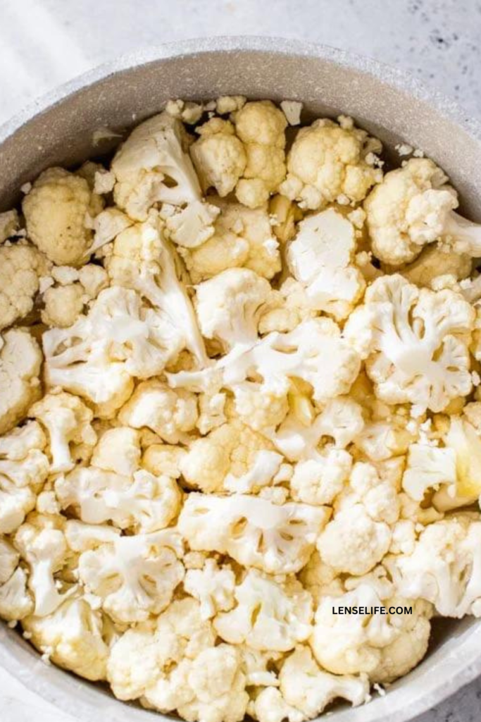 steaming the cauliflower in a pot