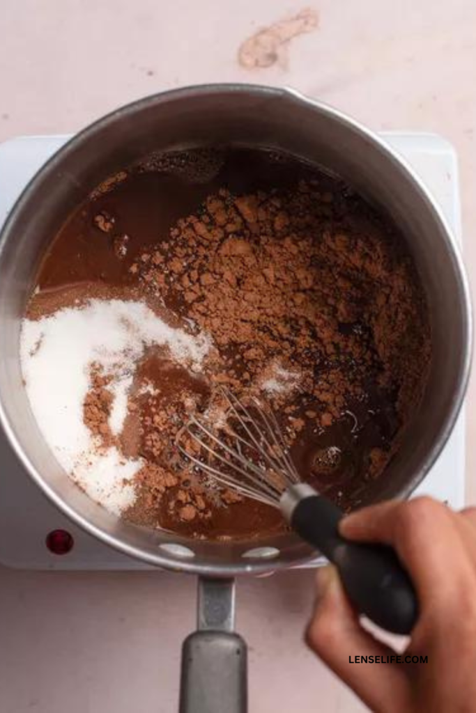 Mixing milk and cacao powder in a sauce pan