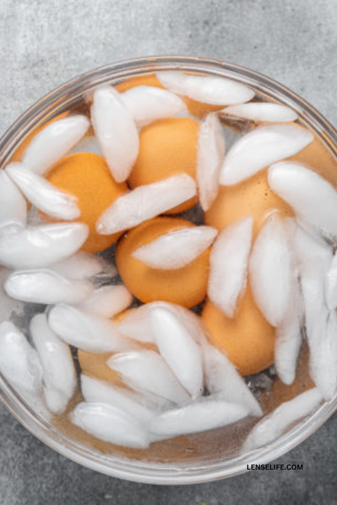 eggs placed in ice water for cooling in a bowl