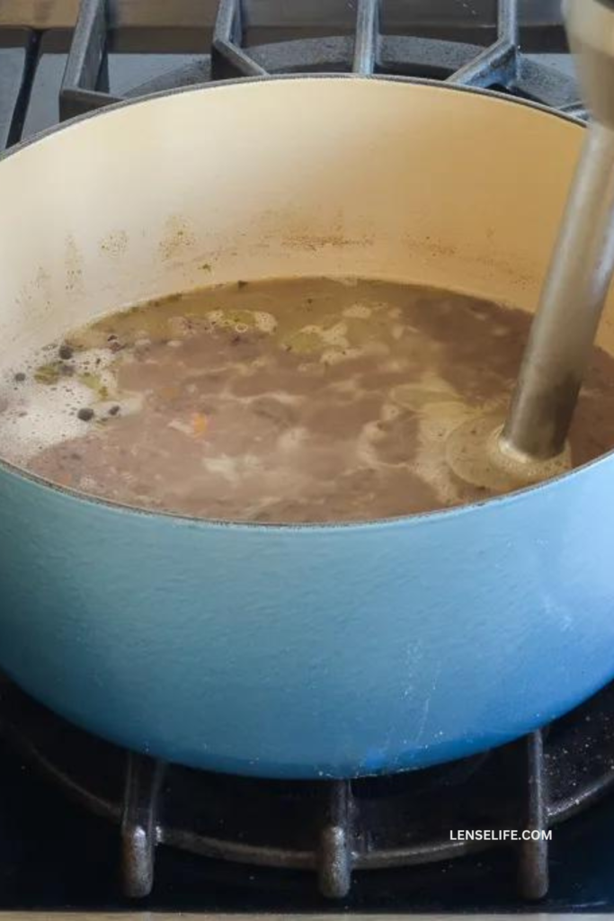 blending the soup in a pot