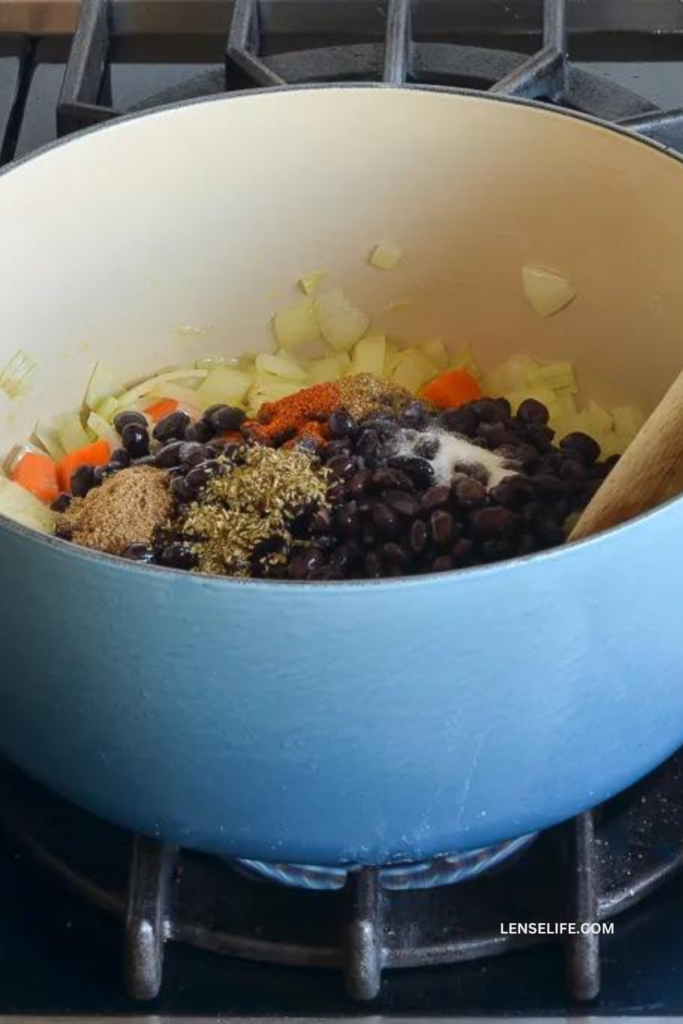 adding beans to the pot