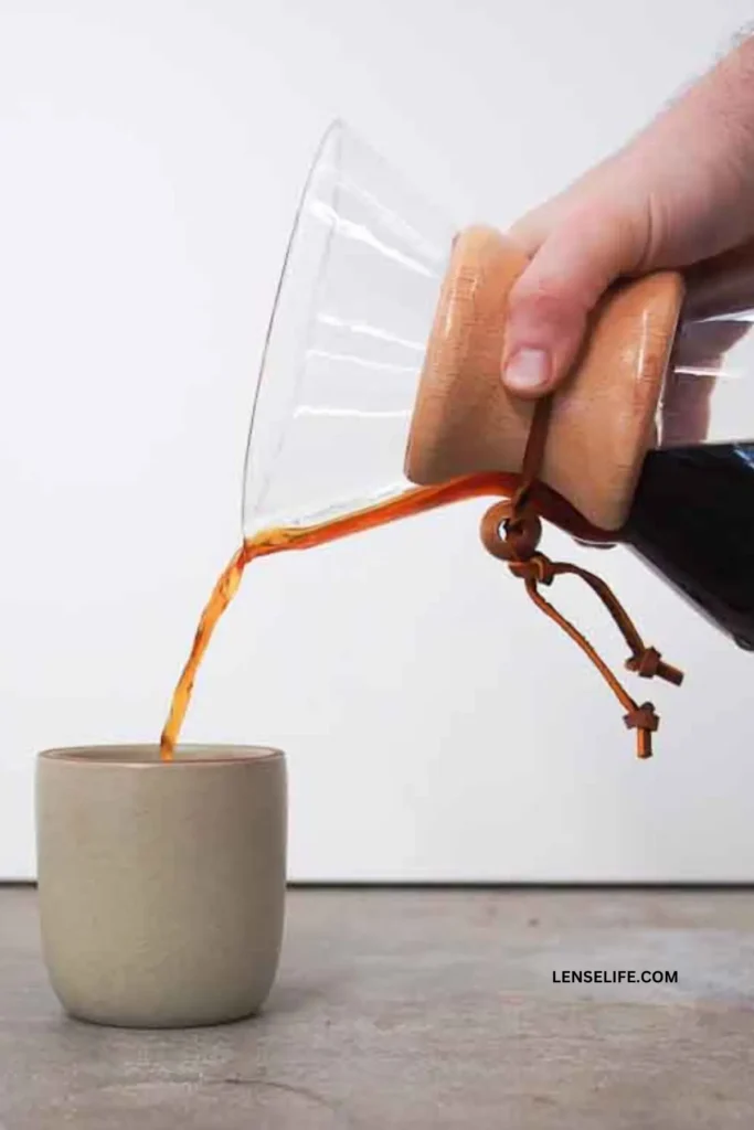 pouring brewed coffee into a mug