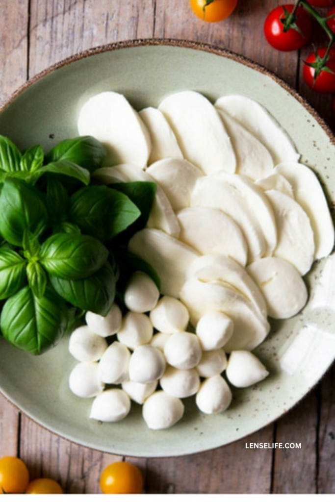 mozzarella and basil leaves on a plate