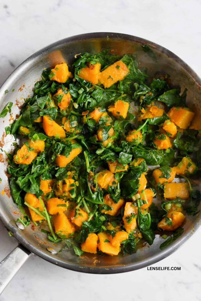 kale and butternut squash on a pan