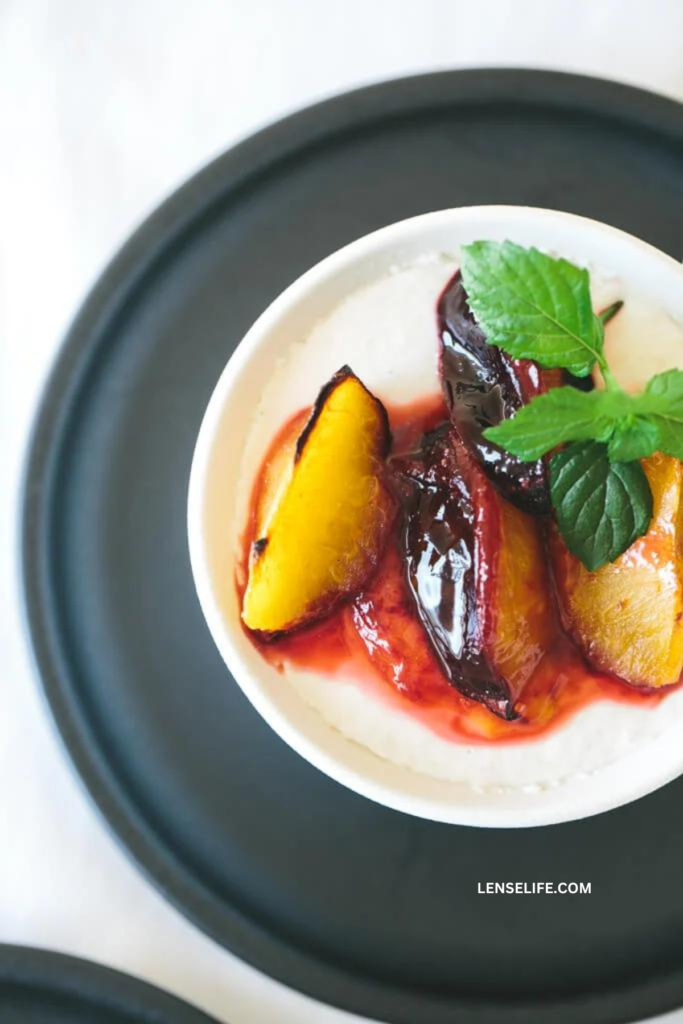 Nectarine Panna Cotta with Roasted Plums in a plate