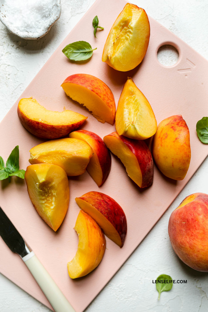 sliced peaches on a cutting board