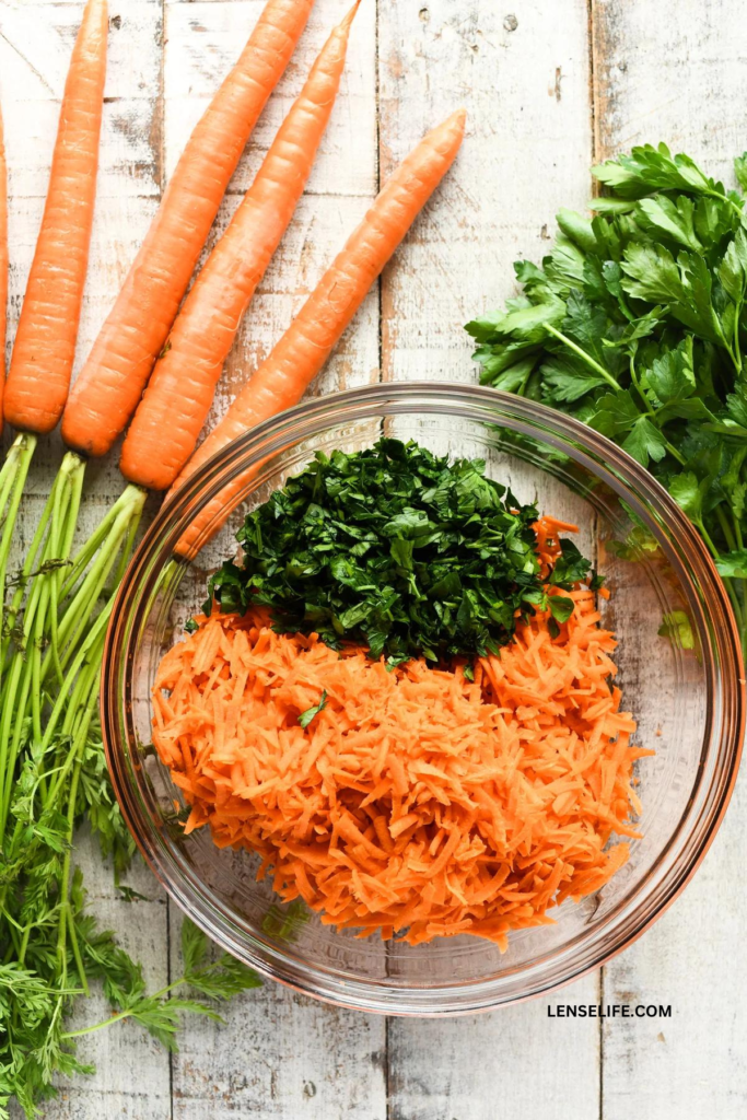 grated carrots and parsley in a bowl