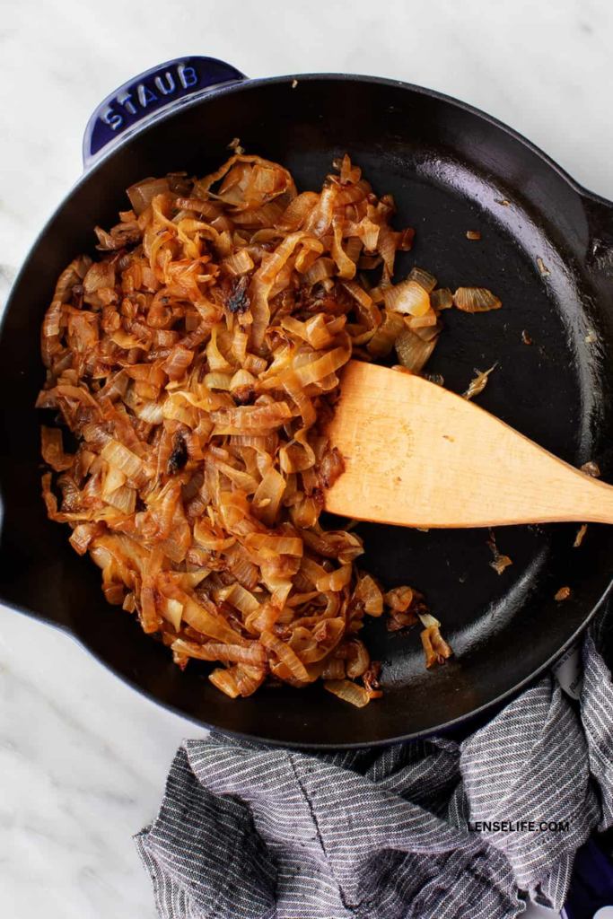 caramelizing the onions in a pan