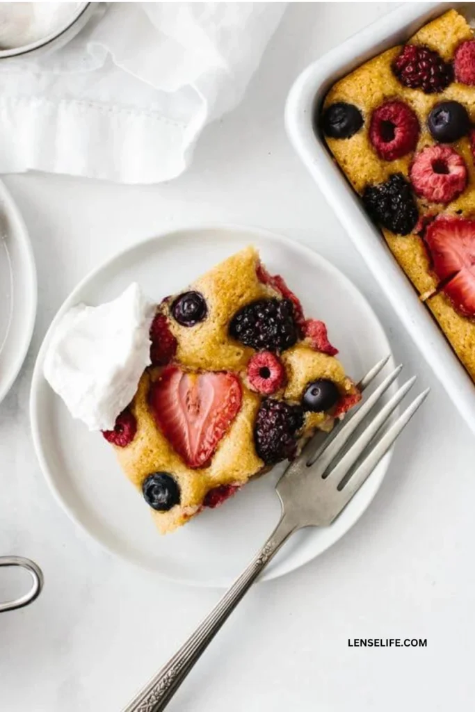 Berry Sheet Cake topped with vanilla ice cream