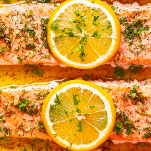 Baked Salmon with lemon wedges