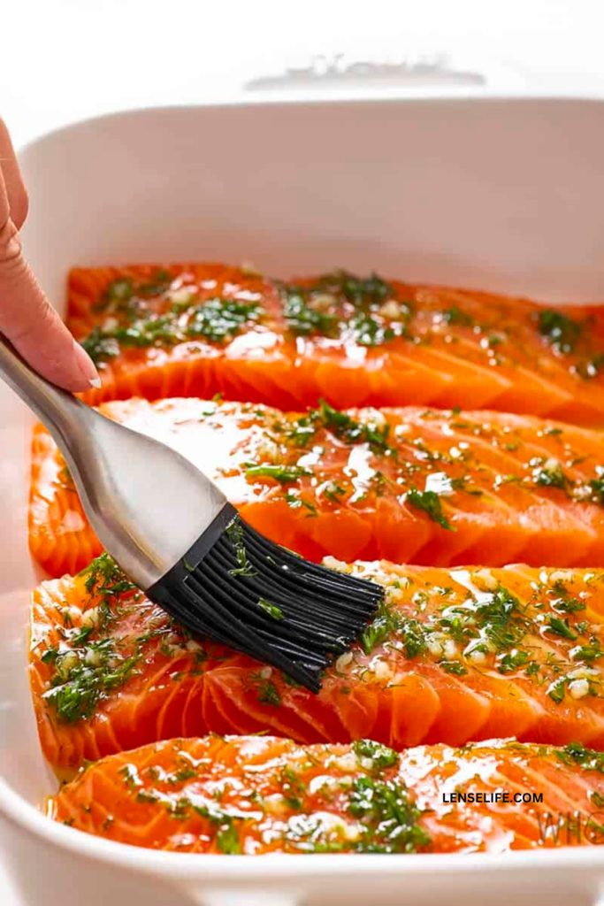 seasoning the salmon in a tray