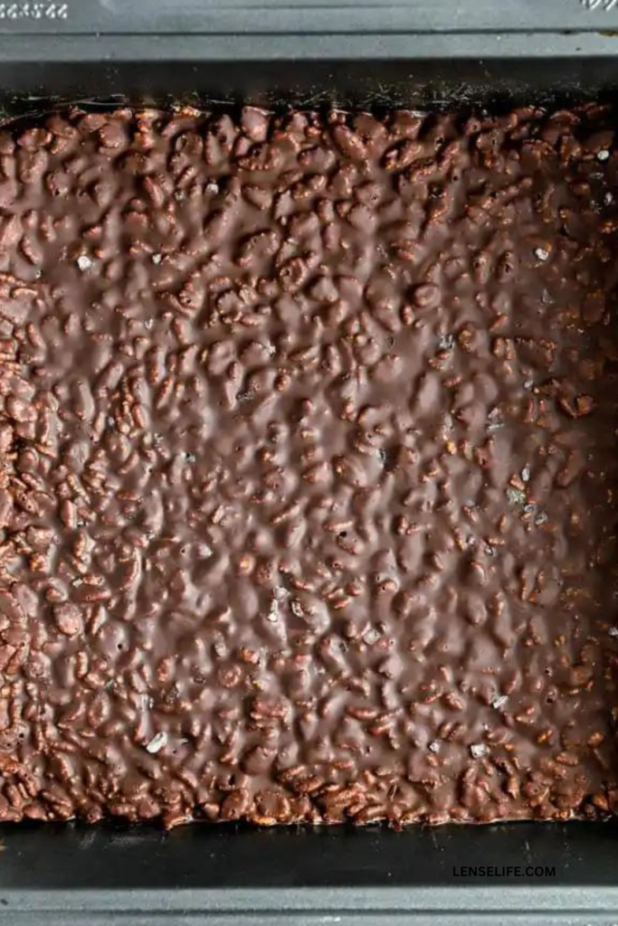Chocolate Crunch Bar mixture in a baking pan