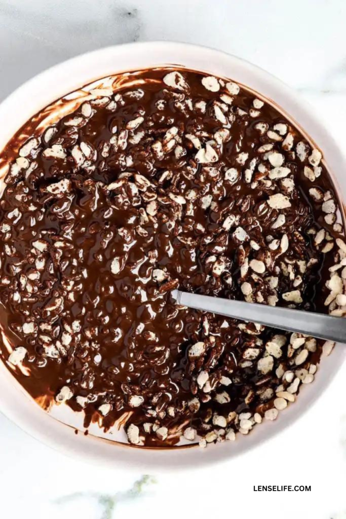 combining chocolate and nuts in a bowl