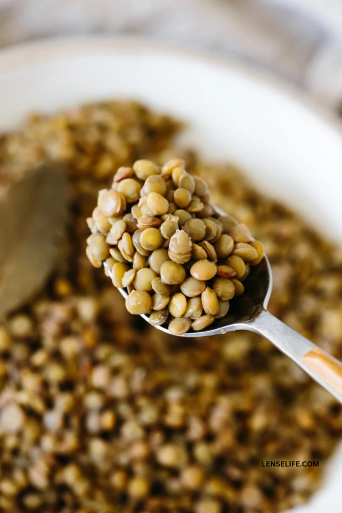 cooked lentils in a spoon