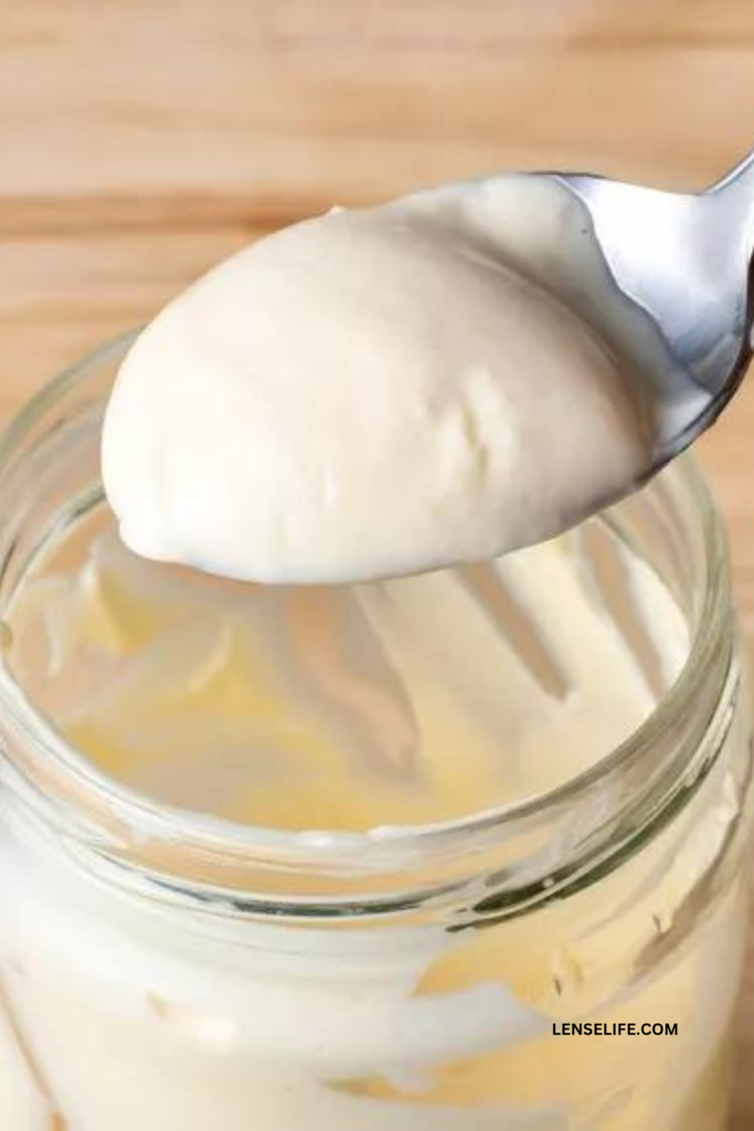 creamy mayonnaise in a spoon