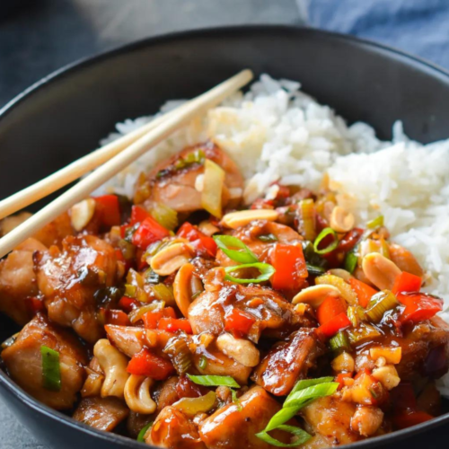 Kung Pao Chicken served with rice in a bowl