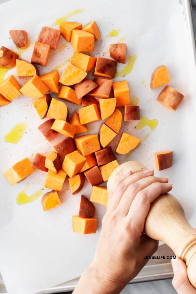 adding spices to the sweet potatoes