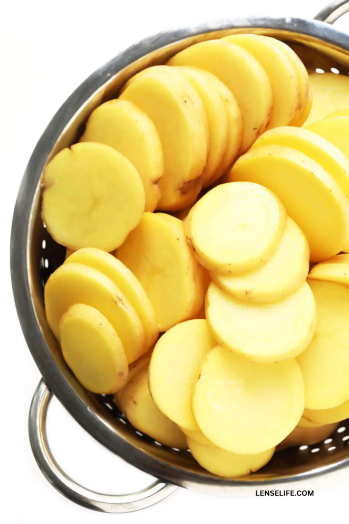 sliced potatoes in a colander